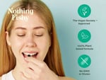 A young woman with long blonde hair smiles while taking a supplement from her hand, promoting a vegan-friendly product. The image highlights key features: vegan certification, plant-based ingredients, and non-GMO status.