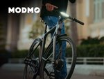 Promotional Modmo Ebike displayed on a scenic route