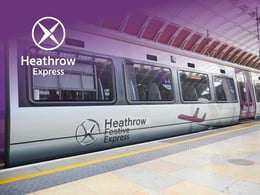 Heathrow Express train at the station, showcasing its branding and modern design, providing quick transport to Heathrow Airport from central London.