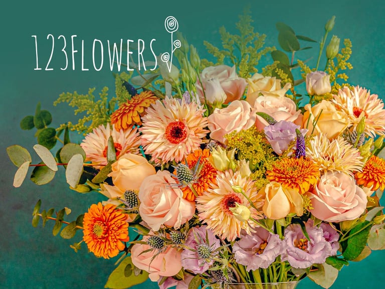 Vibrant Floral Arrangement Featuring A Variety Of Colorful Flowers, Including Roses, Gerbera Daisies, And Lisianthus, Set Against A Teal Background, Showcasing The Elegance Of 123Flowers.