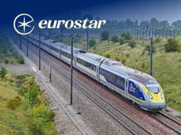 Eurostar high-speed train traveling through lush countryside, showcasing modern rail travel in Europe.