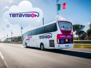 Terravision bus traveling on a highway with Italian flags in the background, showcasing reliable transportation services for travelers in Italy.