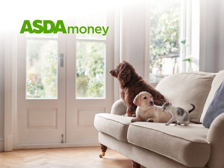 Two Dogs Sitting On A Couch In A Bright Living Room, With The Asda Money Logo Displayed In The Corner. The Scene Conveys A Sense Of Comfort And Companionship In A Home Setting.