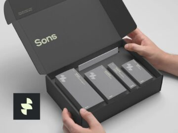 Hands holding an open black box containing four sleek product packages, with the brand name "Sons" prominently displayed on the inside lid. A logo featuring a stylized design is visible in the corner.
