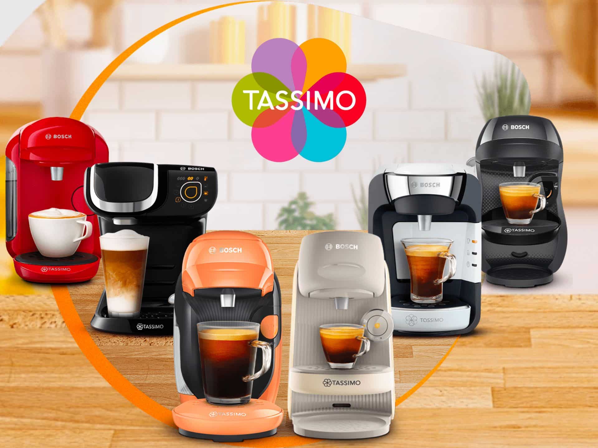 Tassimo Coffee Machines In Various Colors Displayed In A Kitchen Setting, Showcasing The Brand Logo And Highlighting Their Versatility For Brewing Different Beverages.
