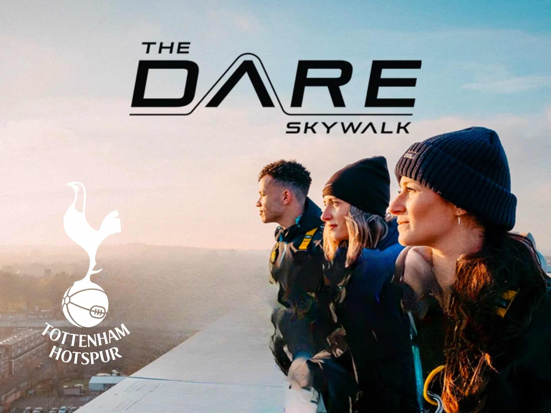 Three Individuals Stand On A Rooftop, Gazing Into The Distance During The Dare Skywalk Experience At Tottenham Hotspur Stadium, Showcasing An Adventurous Outdoor Activity With A Scenic View.