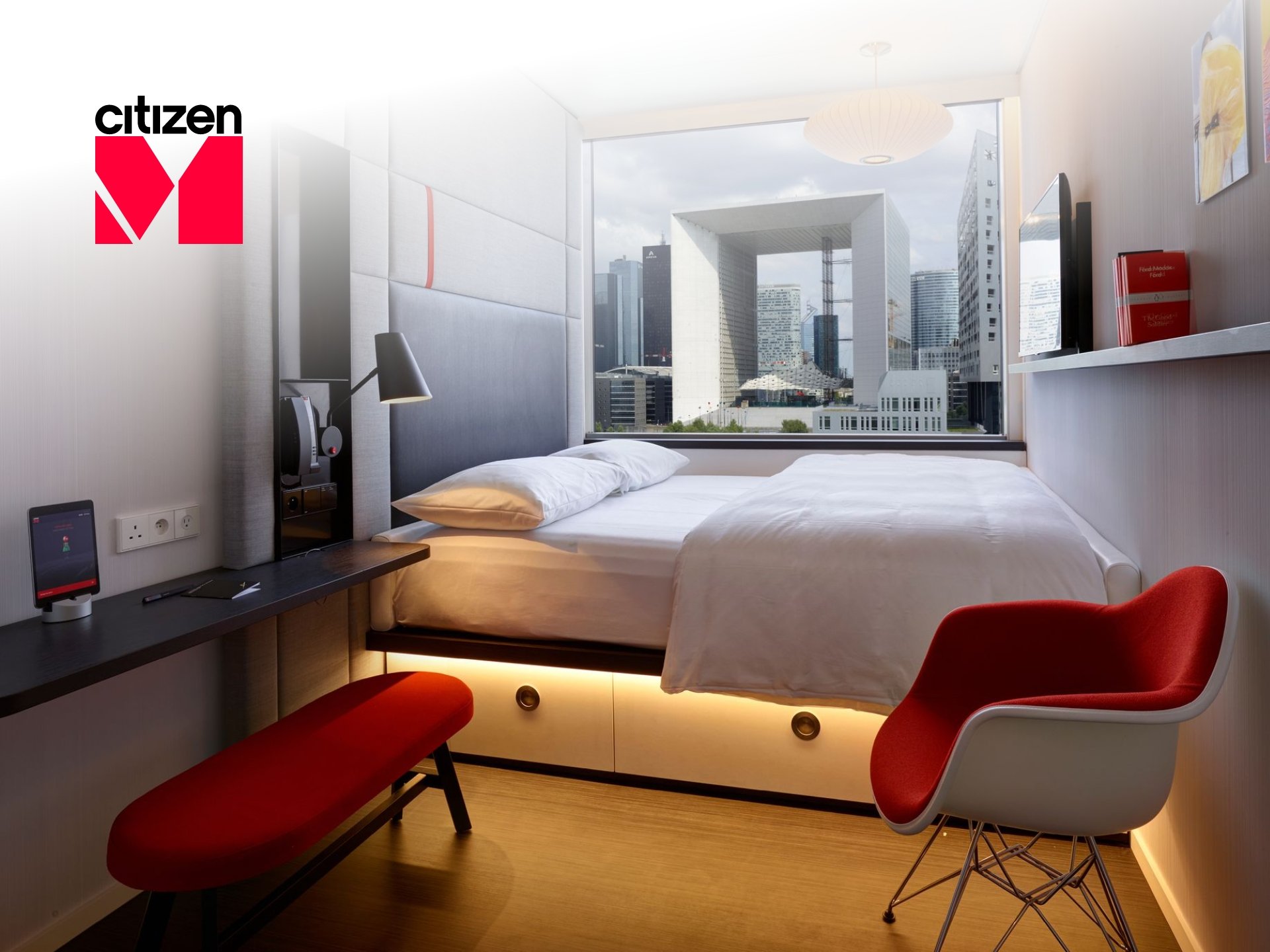 citizenM Discount Code Modern citizenM hotel lobby, stylish design, comfortable seating, urban hotel experience.